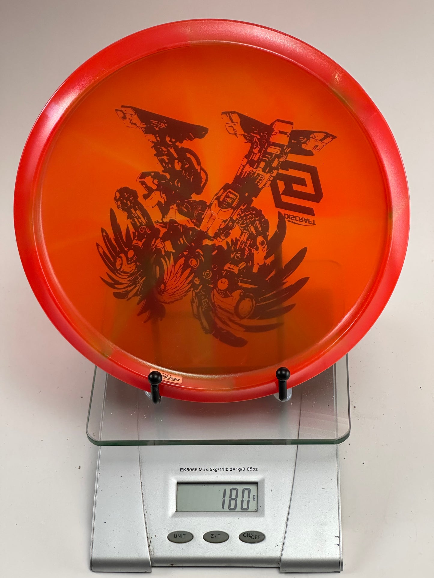 Discraft Buzzz Z Midrange – Transparent Orange w/ Red Rim Robot Stamp