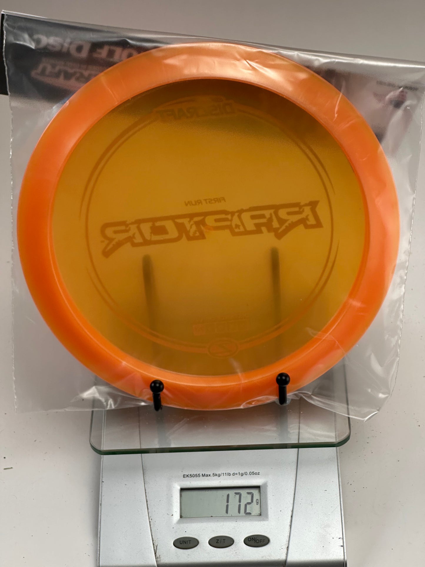 Discraft Raptor First Run Z Distance Driver (172g) - Transparent Orange/Blue