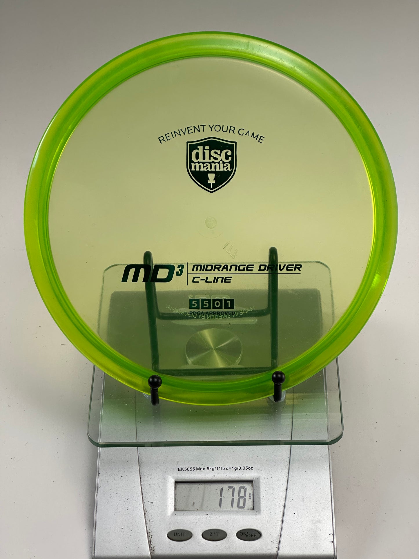 Discmania C-Line MD3 Midrange – Translucent Yellow-Green Shield Stamp
