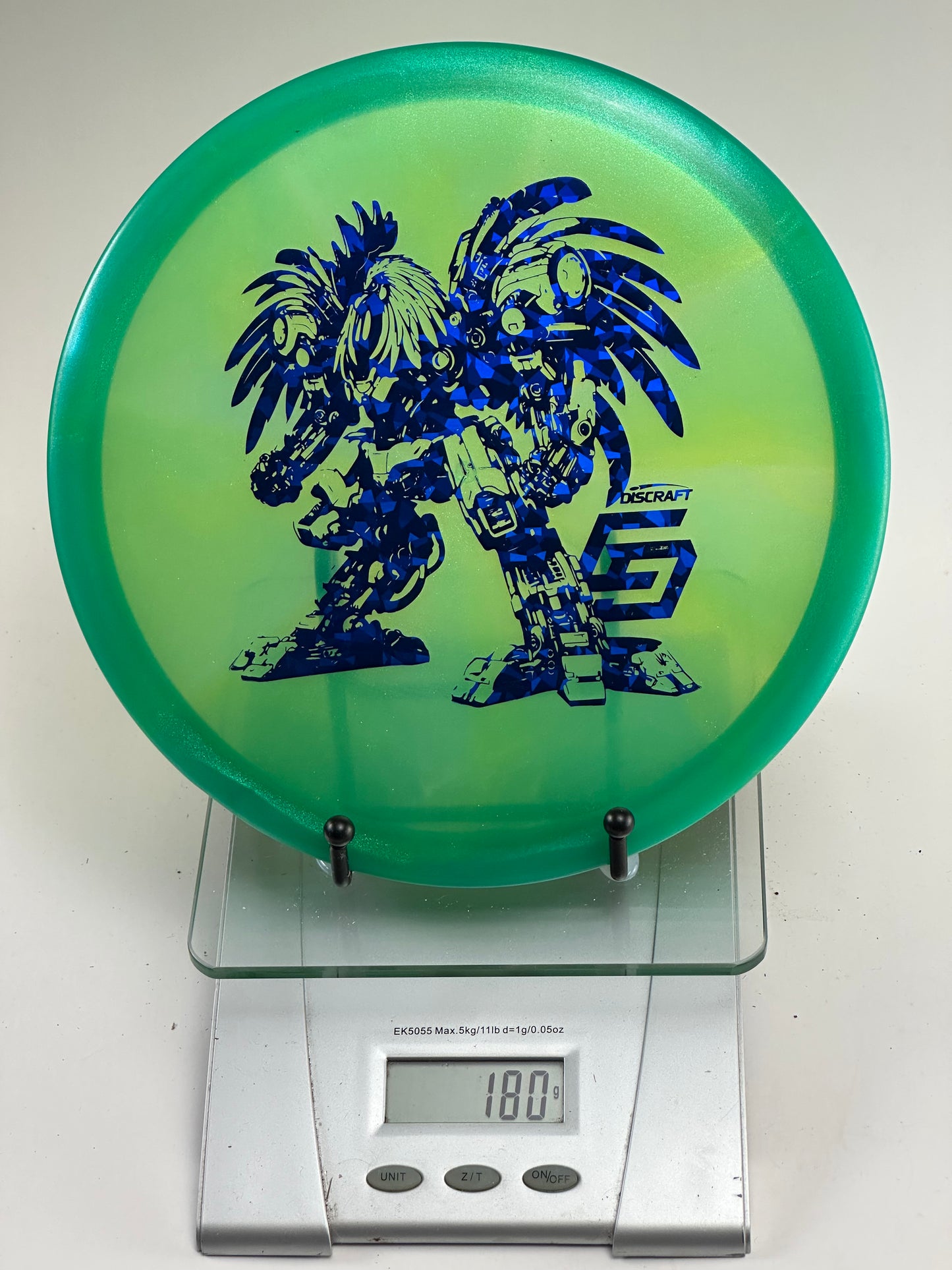 Discraft Buzzz Z Midrange – Transparent Green, Blue Robot Stamp, 180g