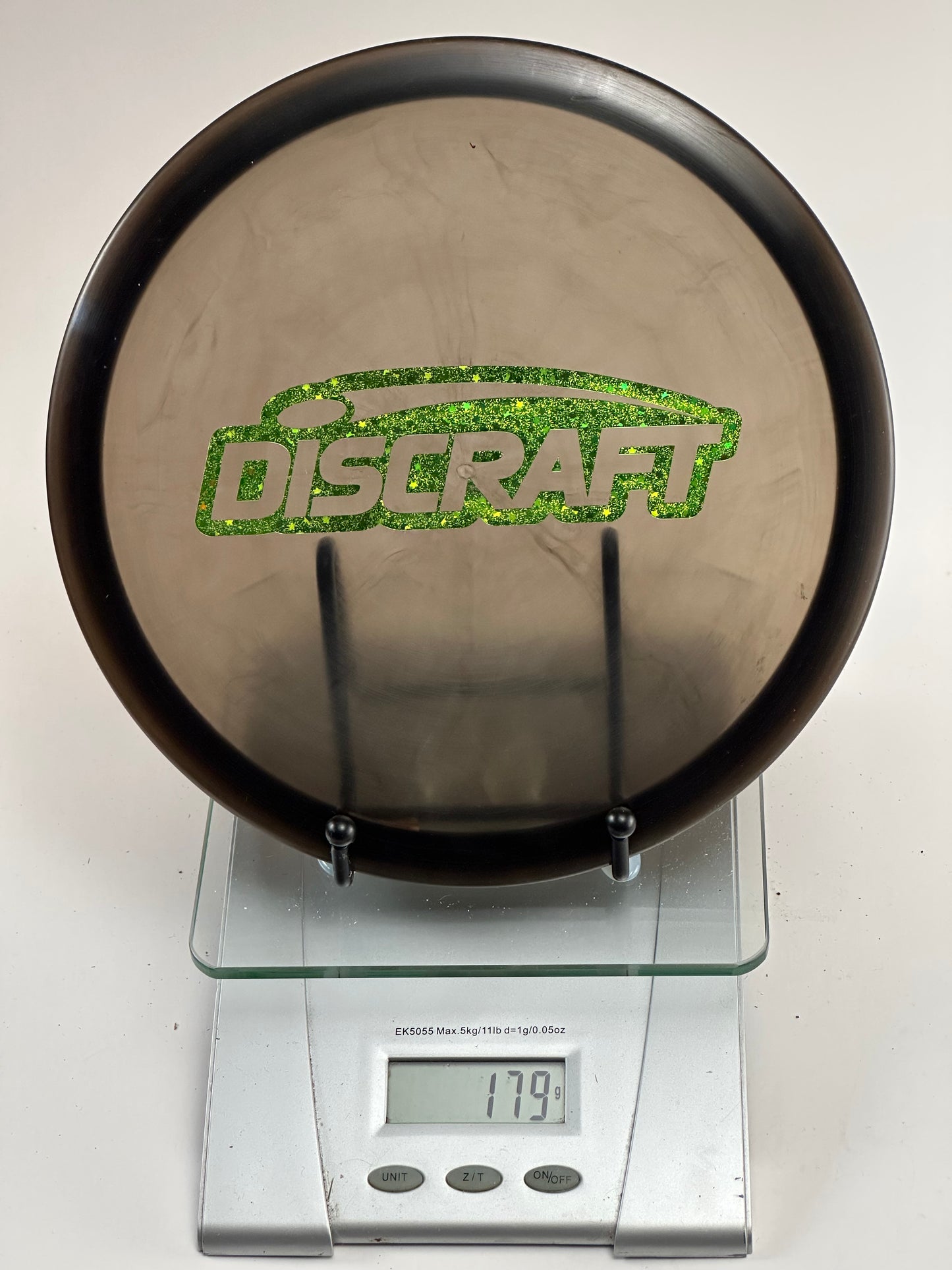 Discraft Buzzz Z Midrange 179g - Transparent Smoke w/ Green Glitter Stamp
