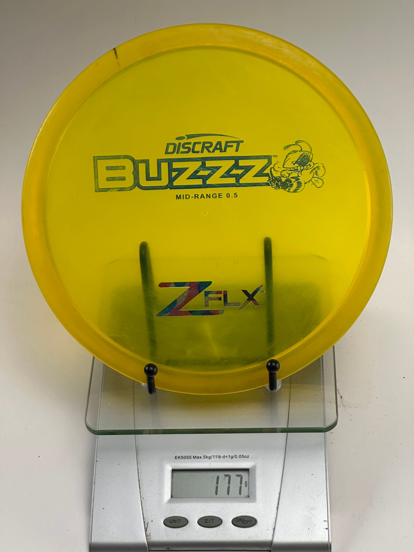 Discraft Buzzz Z FLX Midrange (177g) – Transparent Yellow Bee Stamp