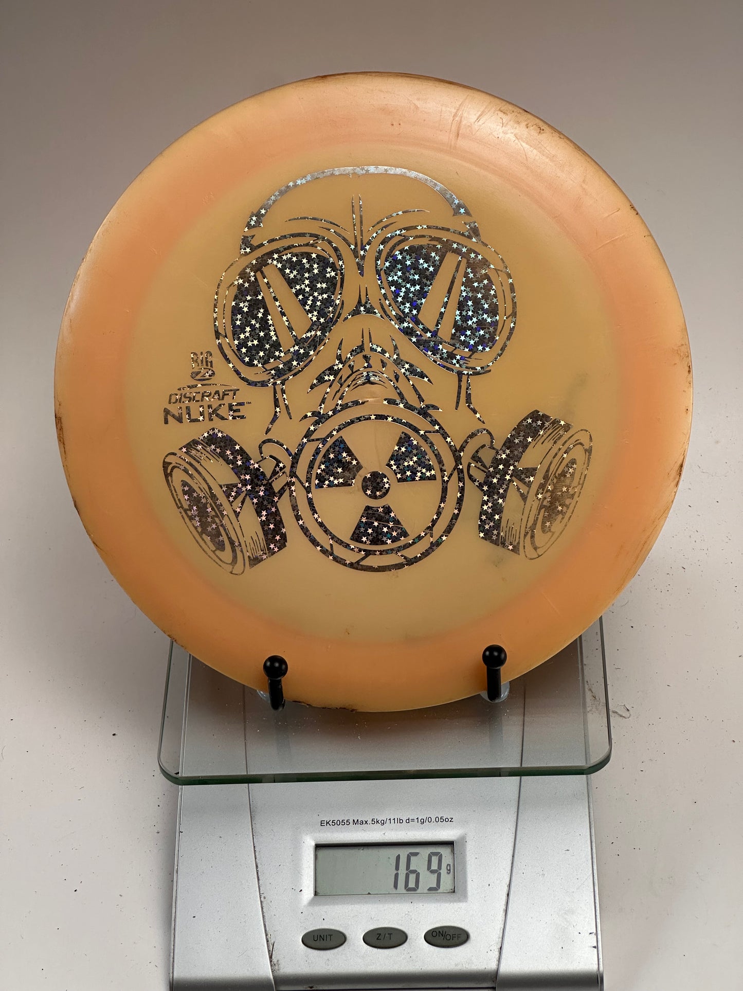 Discraft Z Nuke Distance Driver – Big Z Gas Mask Stamp, Clear Orange
