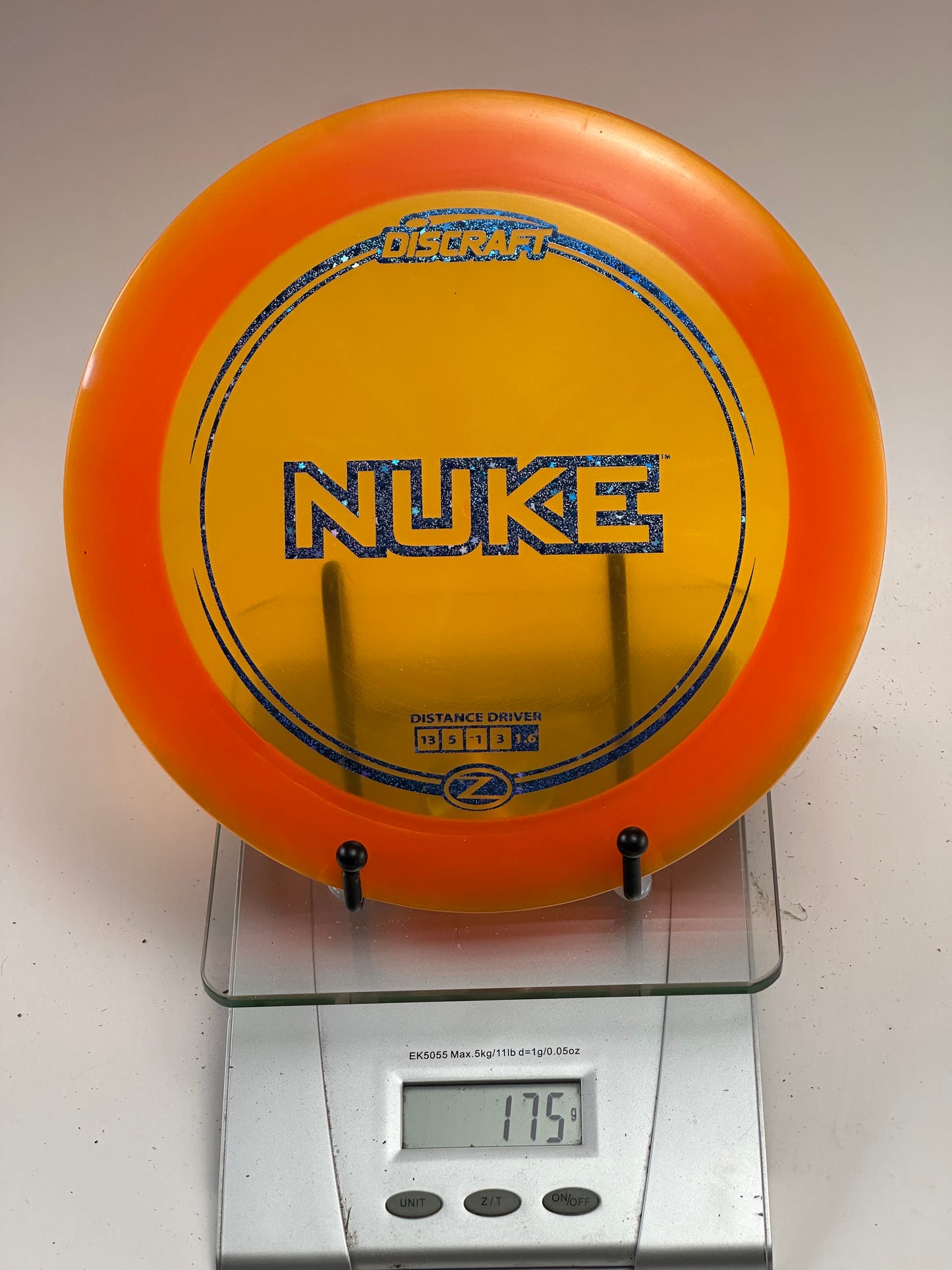 Discraft Z Nuke Distance Driver – Yellow/Orange, Blue Glitter Stamp (175g)