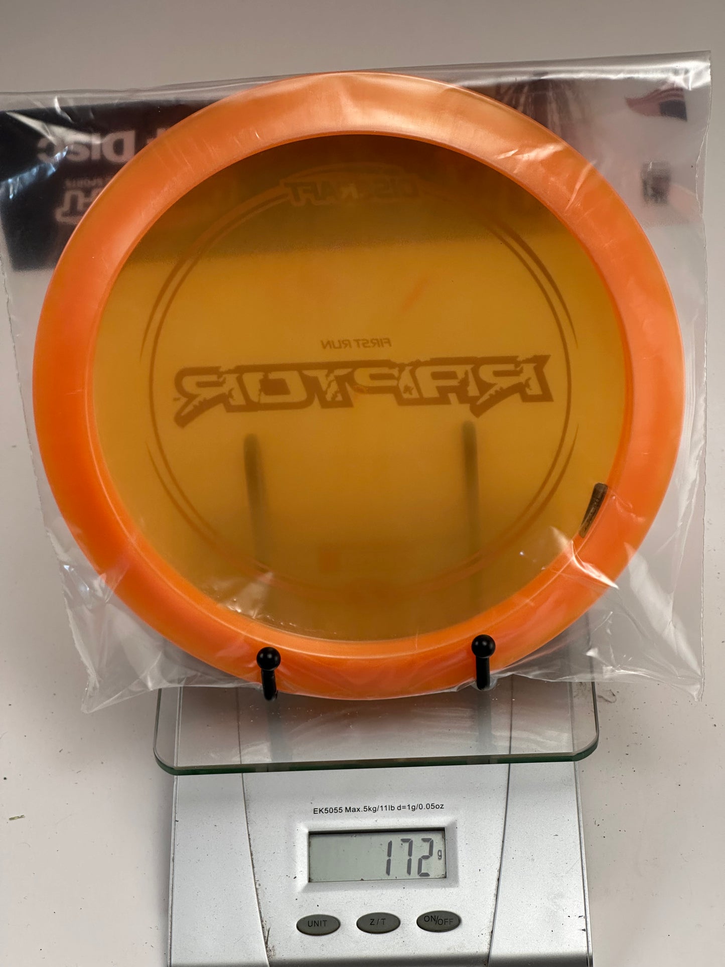 Discraft Z Raptor First Run Distance Driver - Transparent Orange w/ Blue Stamp