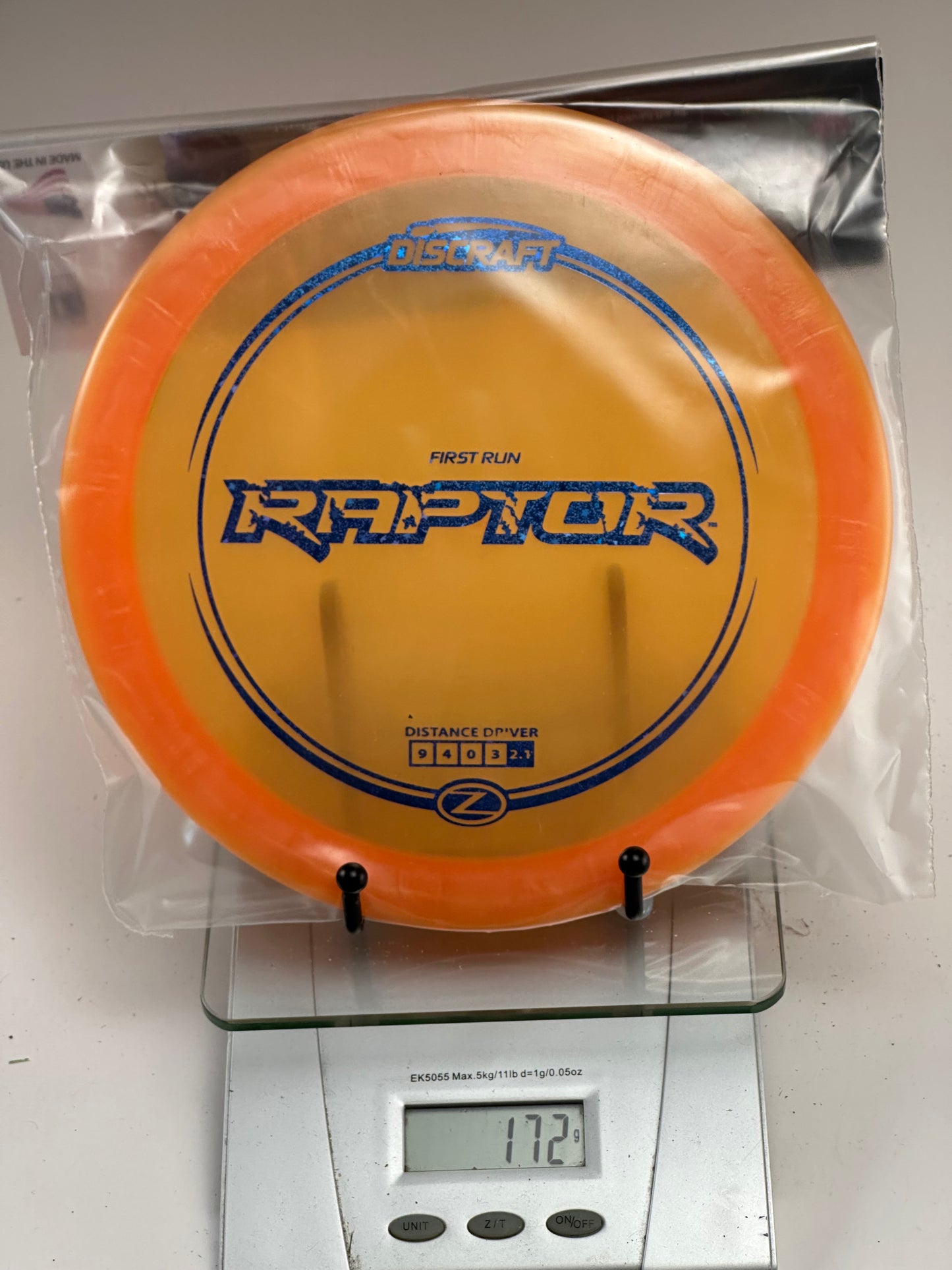 Discraft Raptor First Run Z Distance Driver (172g) - Transparent Orange/Blue