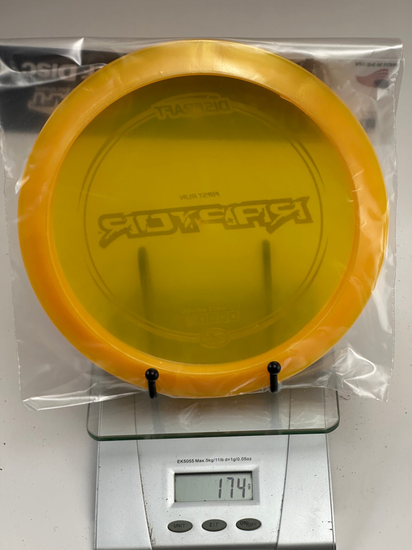 Discraft Z Raptor First Run Distance Driver – Clear Yellow/Orange Rim