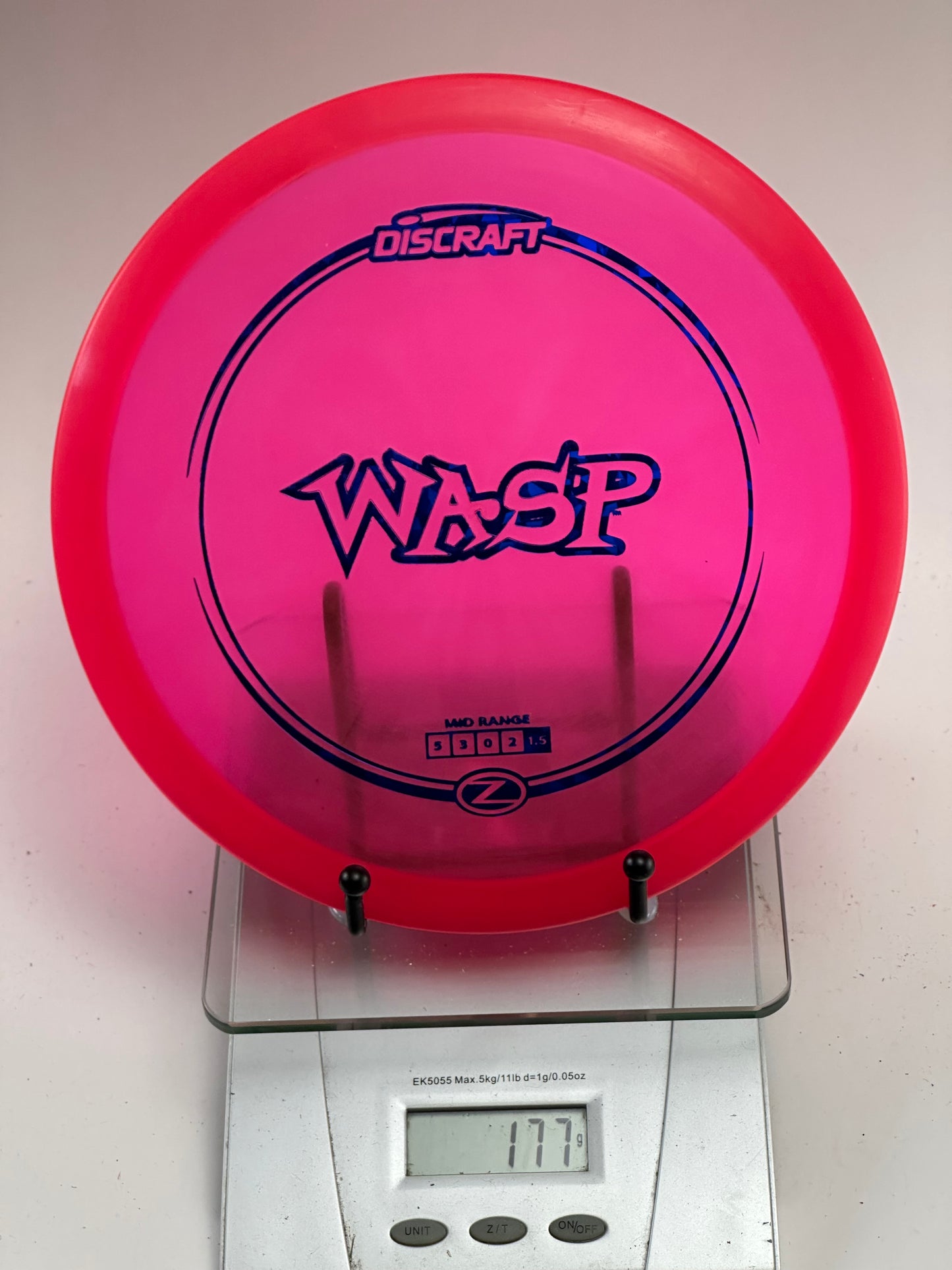 Discraft Z Wasp Midrange – Transparent Pink w/ Blue Stamp