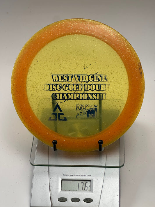 Innova Ape Champion Glow (Glo) Sparkle Orange Rim Yellow Center - Tournament Stamp