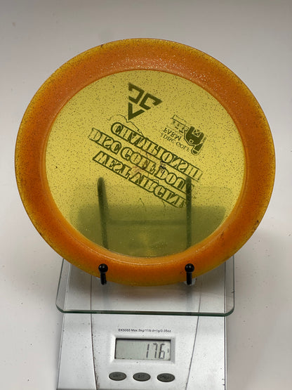 Innova Ape Champion Glow (Glo) Sparkle Orange Rim Yellow Center - Tournament Stamp