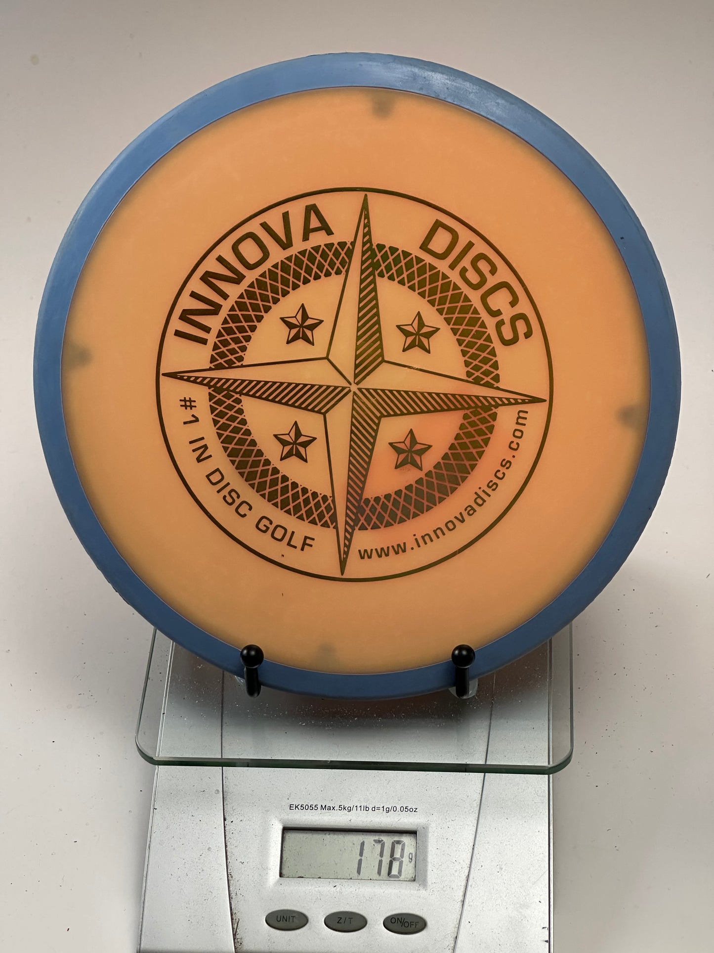 Innova Star Atlas Overmold Midrange – Orange w/ Blue Rim (178g)