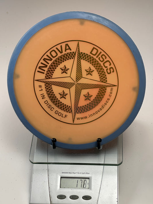 Innova Star Atlas Overmold Midrange – Orange w/ Blue Rim (178g)