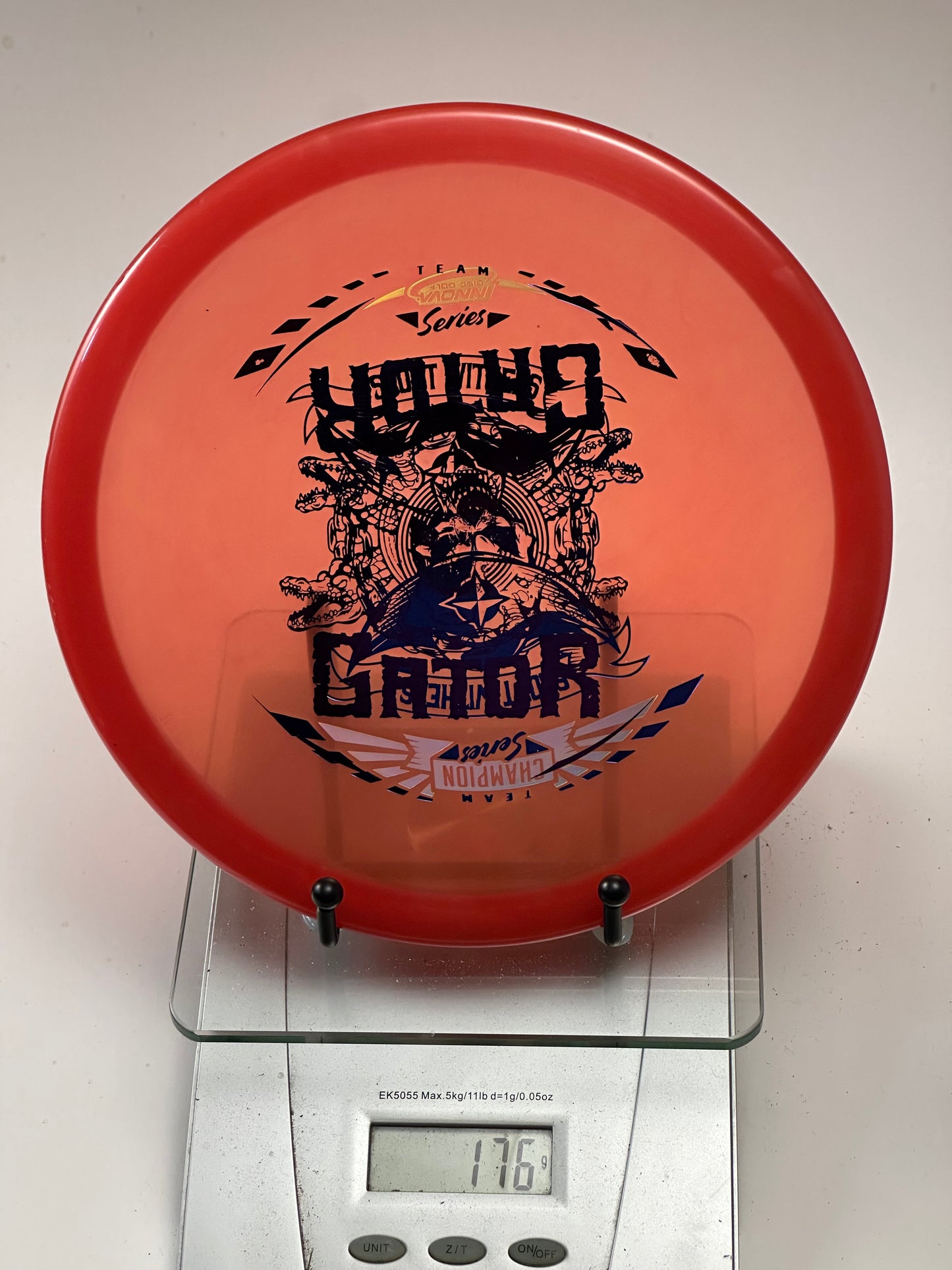 Innova Champion Gator – Team Champion Series Stamp (Transparent Red)