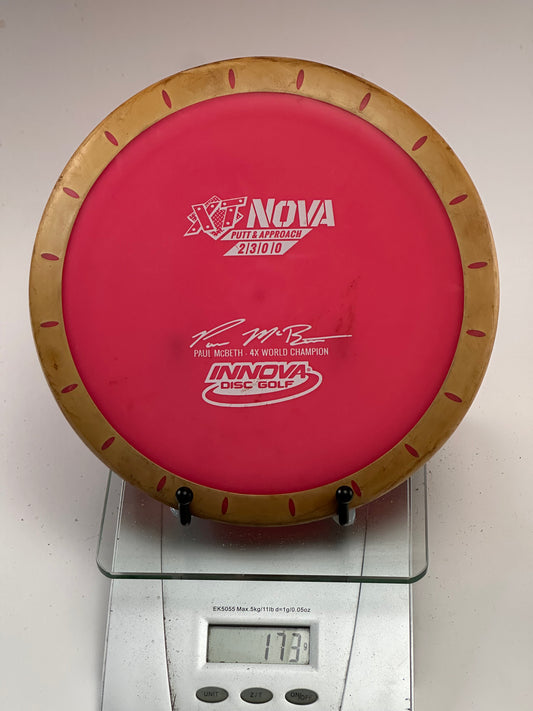 Innova XT Nova (Pink w/ Tan Overmold) Paul McBeth Compass Stamp