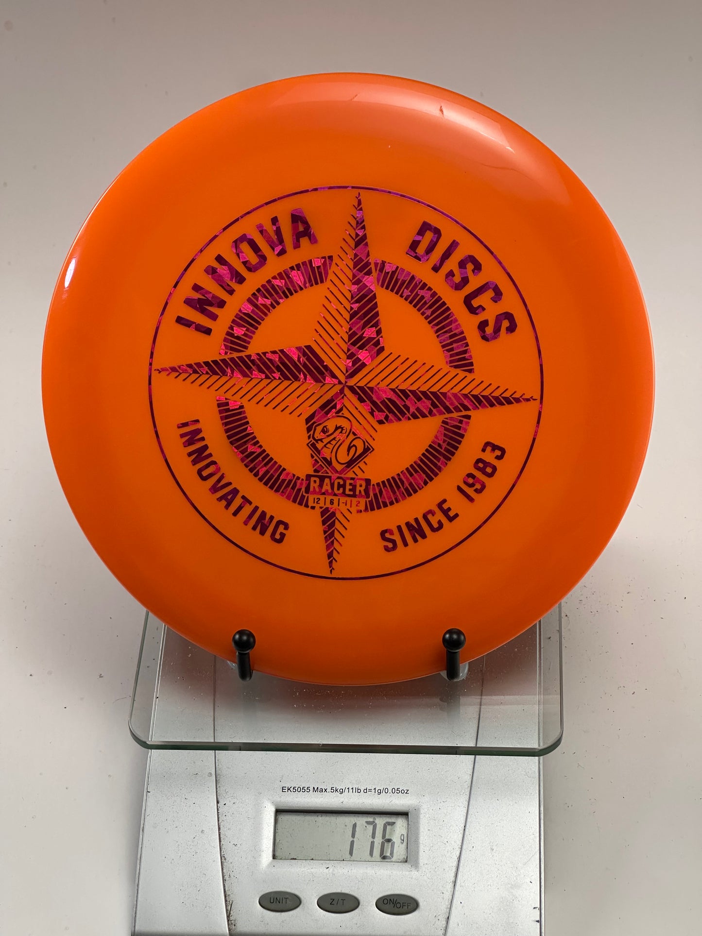 Innova Champion Racer – Orange w/ Pink Shatter Foil Stamp (176g)