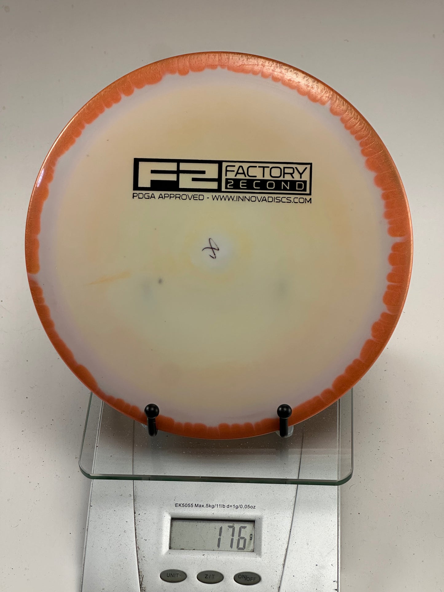 Innova F2 Star Savant – Swirly Cream w/ Orange Rim (176g)