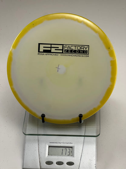 Innova Star F2 Savant – Swirly Yellow Rim, Cloudy Center (173g)
