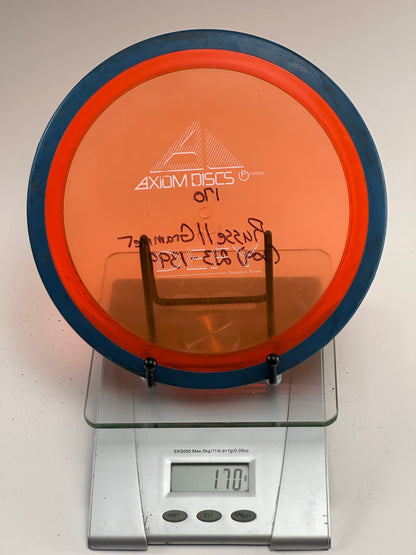 Axiom Defy Proton Distance Driver 170g Orange Transparent w/ Blue Rim