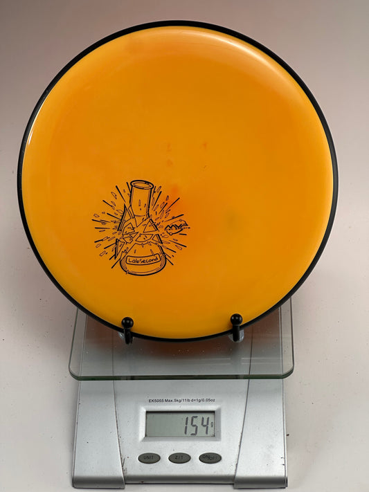 MVP Glitch R2 Neutron (Lab Second) – Orange w/ Black Rim, 154g