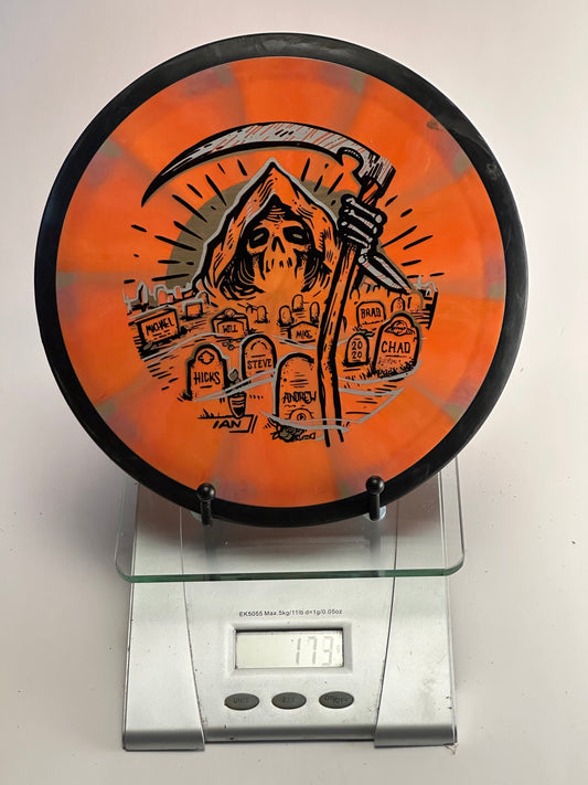 MVP Plasma Tesla Distance Driver 174g - Orange/Gray Swirl, Black Rim, Grim Reaper