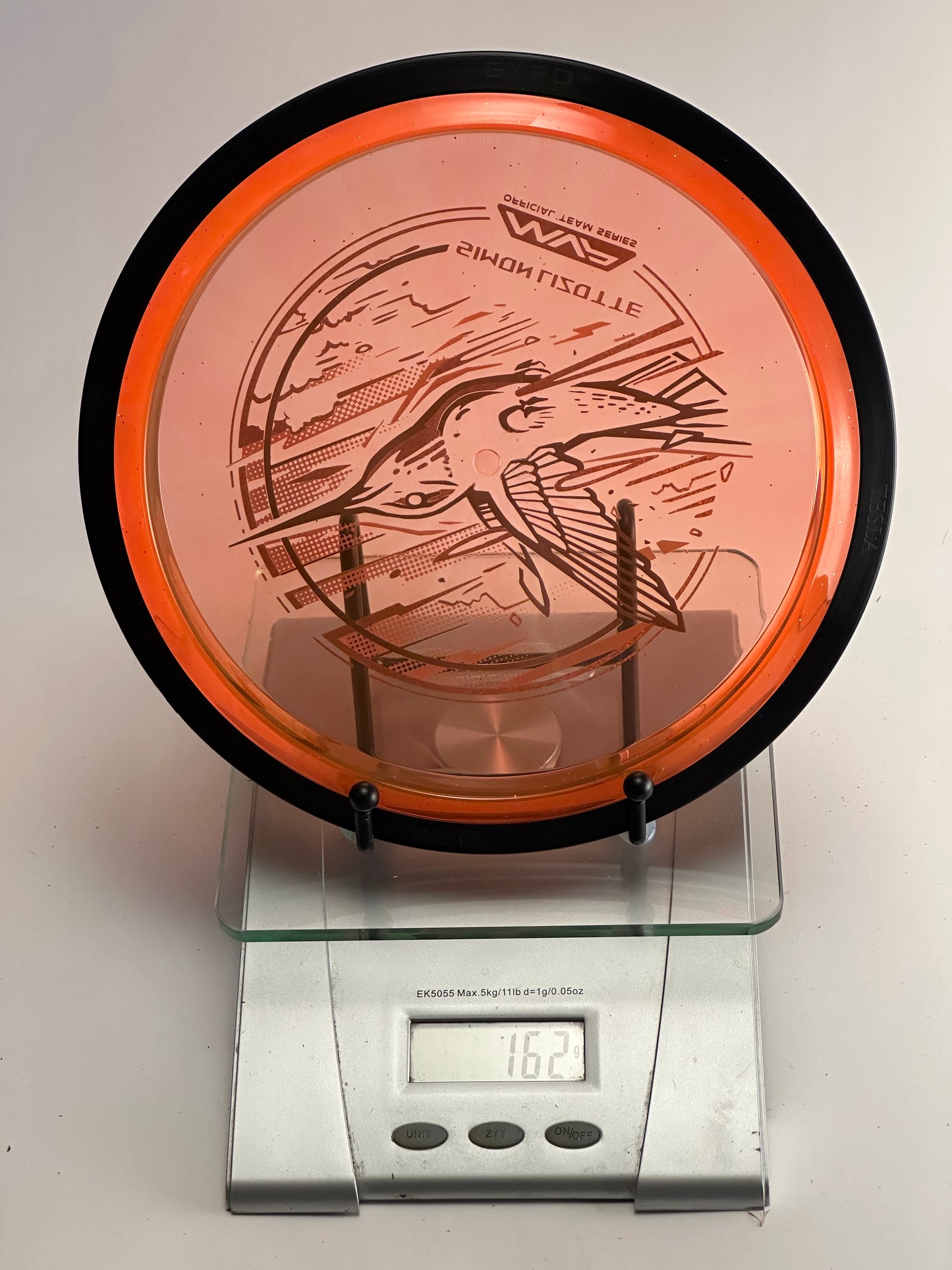 MVP Plasma Tesla Simon Lizotte Team Series (Hummingbird) 162g Orange Clear/Black Rim