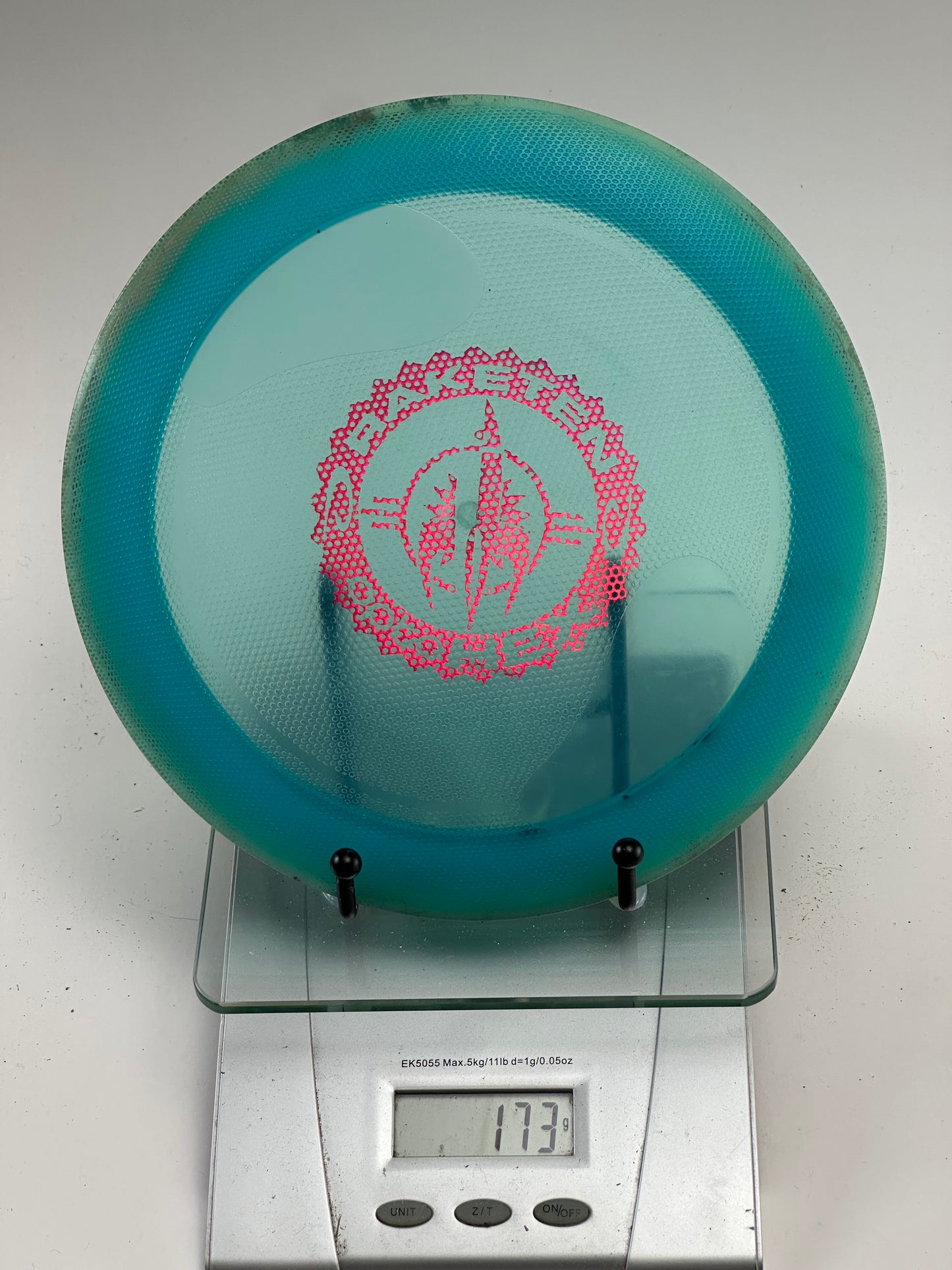 Trilogy Raketen Opto Hex Overmold Disc Golf Disc – Teal, Pink Stamp (173g)